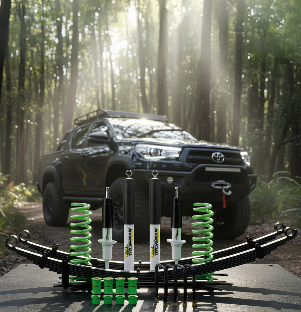 Toyota truck with suspension components and springs in a forest setting