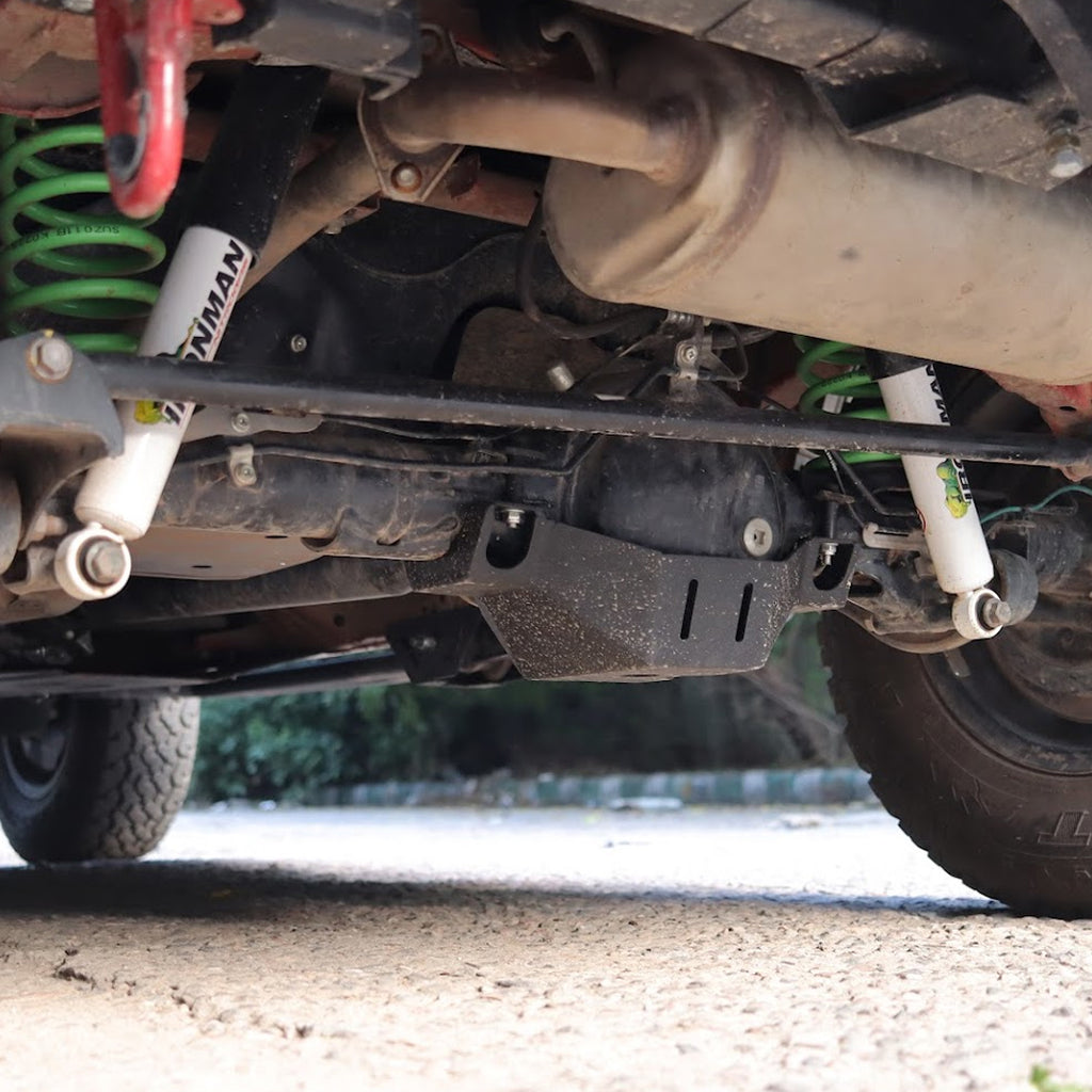 Close-up of a vehicle's undercarriage with suspension components.
